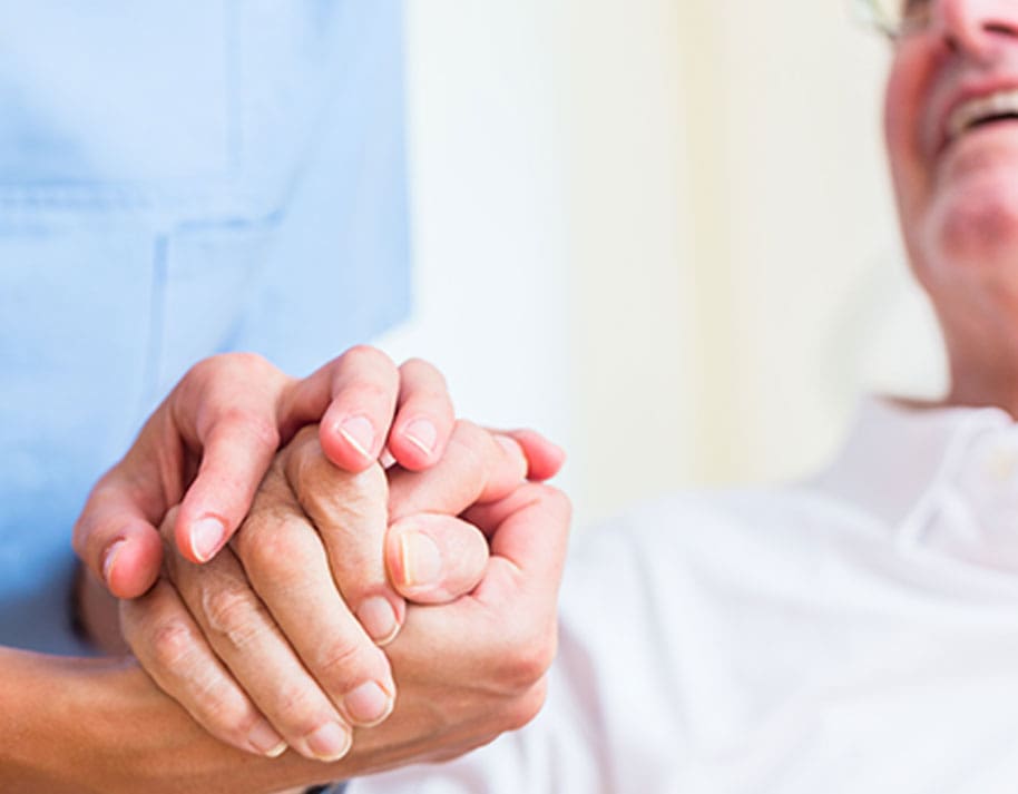 patient holding provider's hand